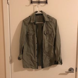 Worn out green jacket blouse